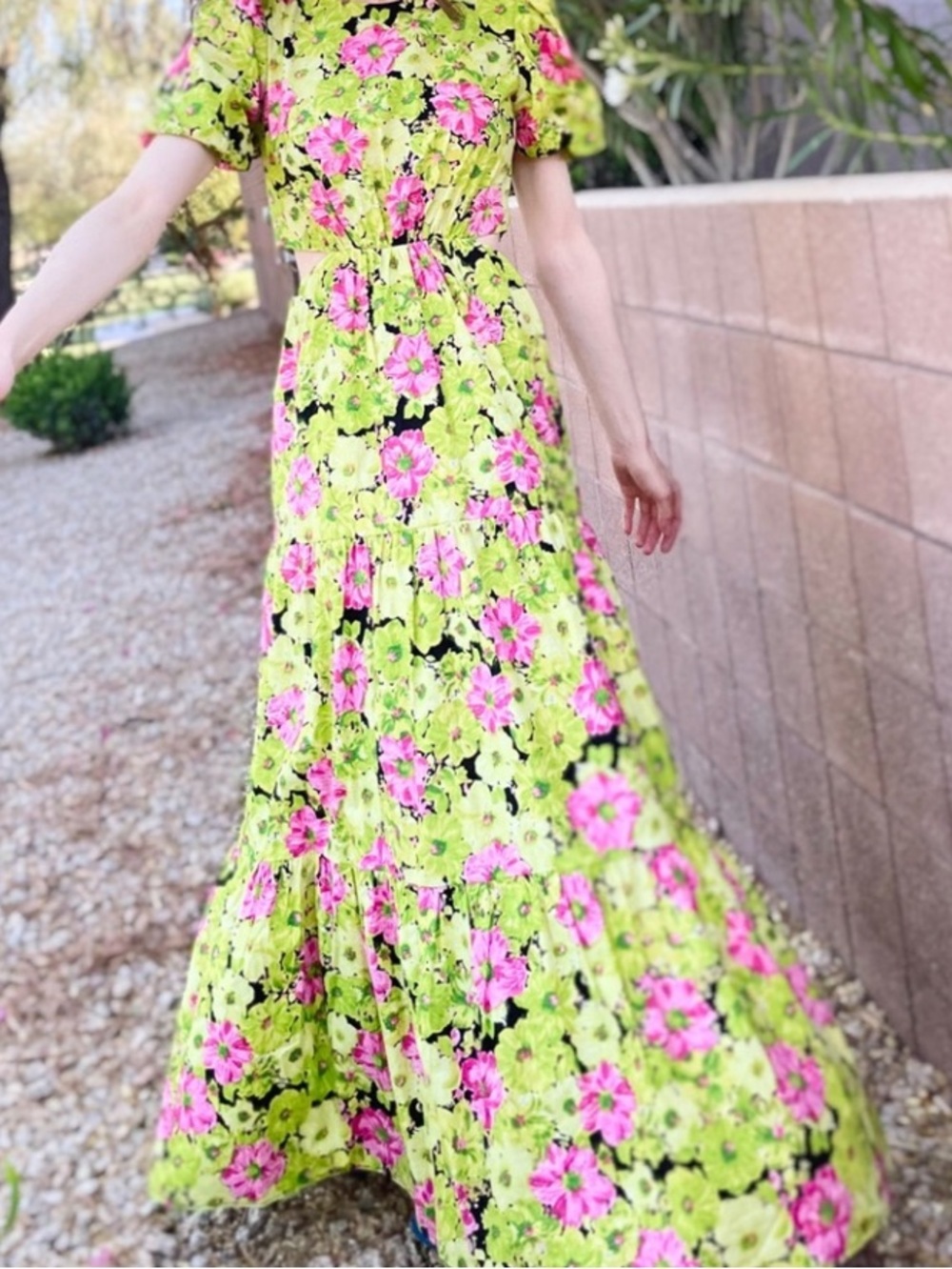 WAYF Plaza Cut Out Tiered Maxi Dress in a lime green and pink floral print.